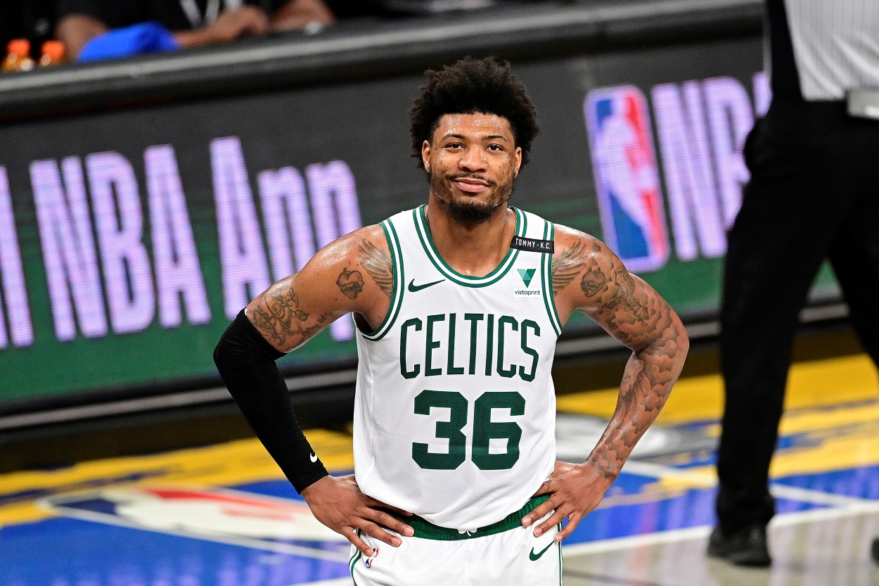 Marcus Smart of the Boston Celtics grins during a game against the Brooklyn Nets.