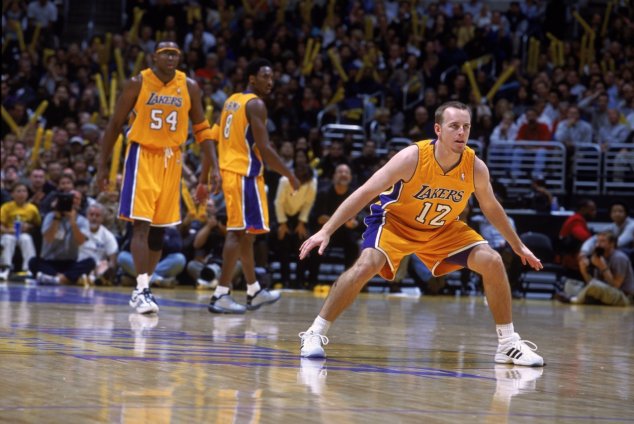 Los Angeles Lakers guard Mike Penberthy is in his defensive stance in a game against the Utah Jazz.
