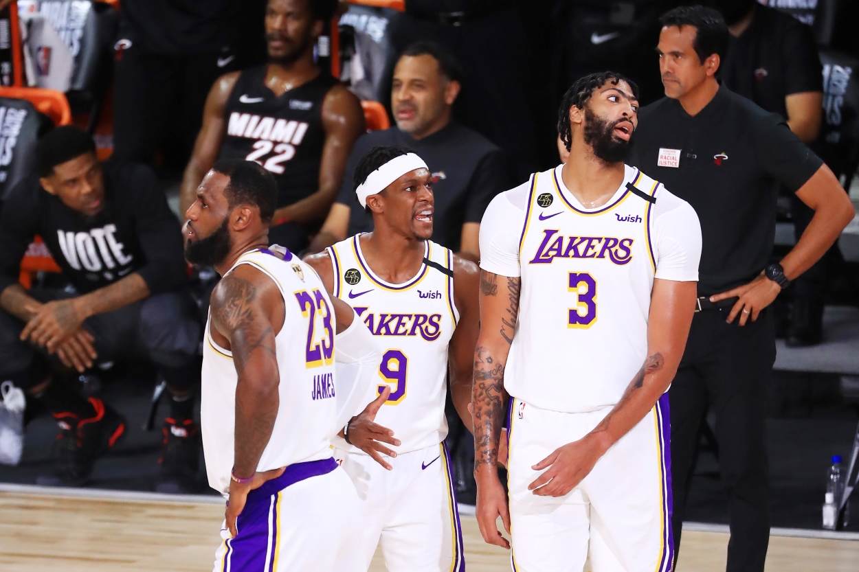 Rajon Rondo of the Los Angeles Lakers, Anthony Davis of the Los Angeles Lakers and LeBron James of the Los Angeles Lakers react during the second quarter against the Miami Heat in Game Six of the 2020 NBA Finals. The three won a championship together for LA in 2020.