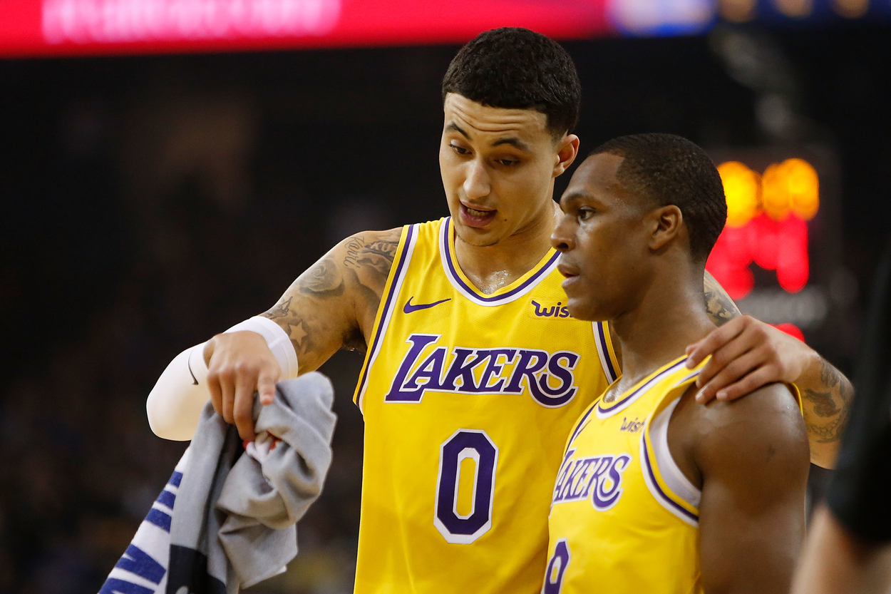 Former Los Angeles Lakers teammates Kyle Kuzma and Rajon Rondo have a discussion on the court.