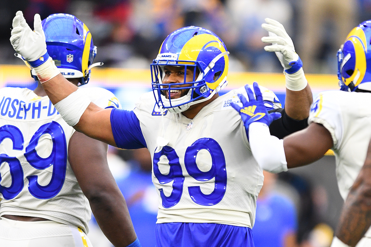 Aaron Donald, #99 of the Los Angeles Rams, cheers on the crowd during the NFL game between the Tampa Bay Buccaneers and the Rams on September 26, 2021, at SoFi Stadium in Inglewood, California