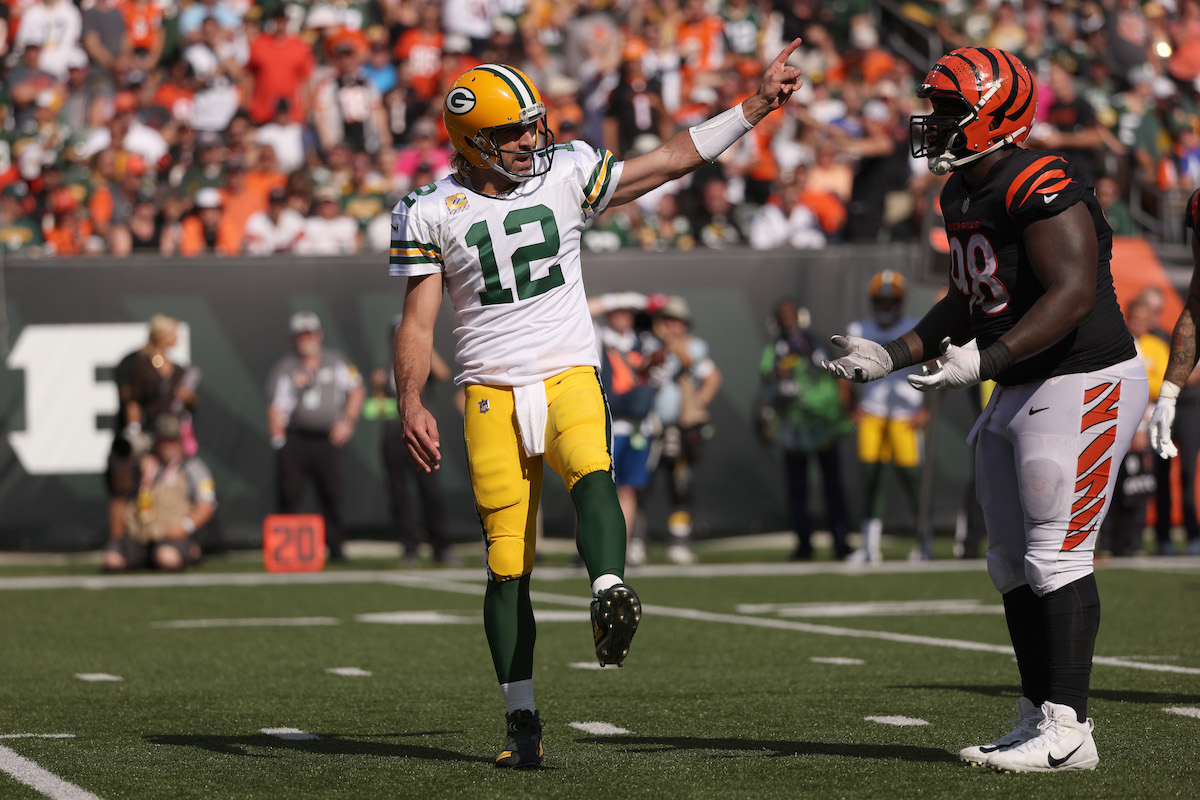 Aaron Rodgers of the Green Bay Packers reacts to a penalty call against D.J. Reader of the Cincinnati Bengals