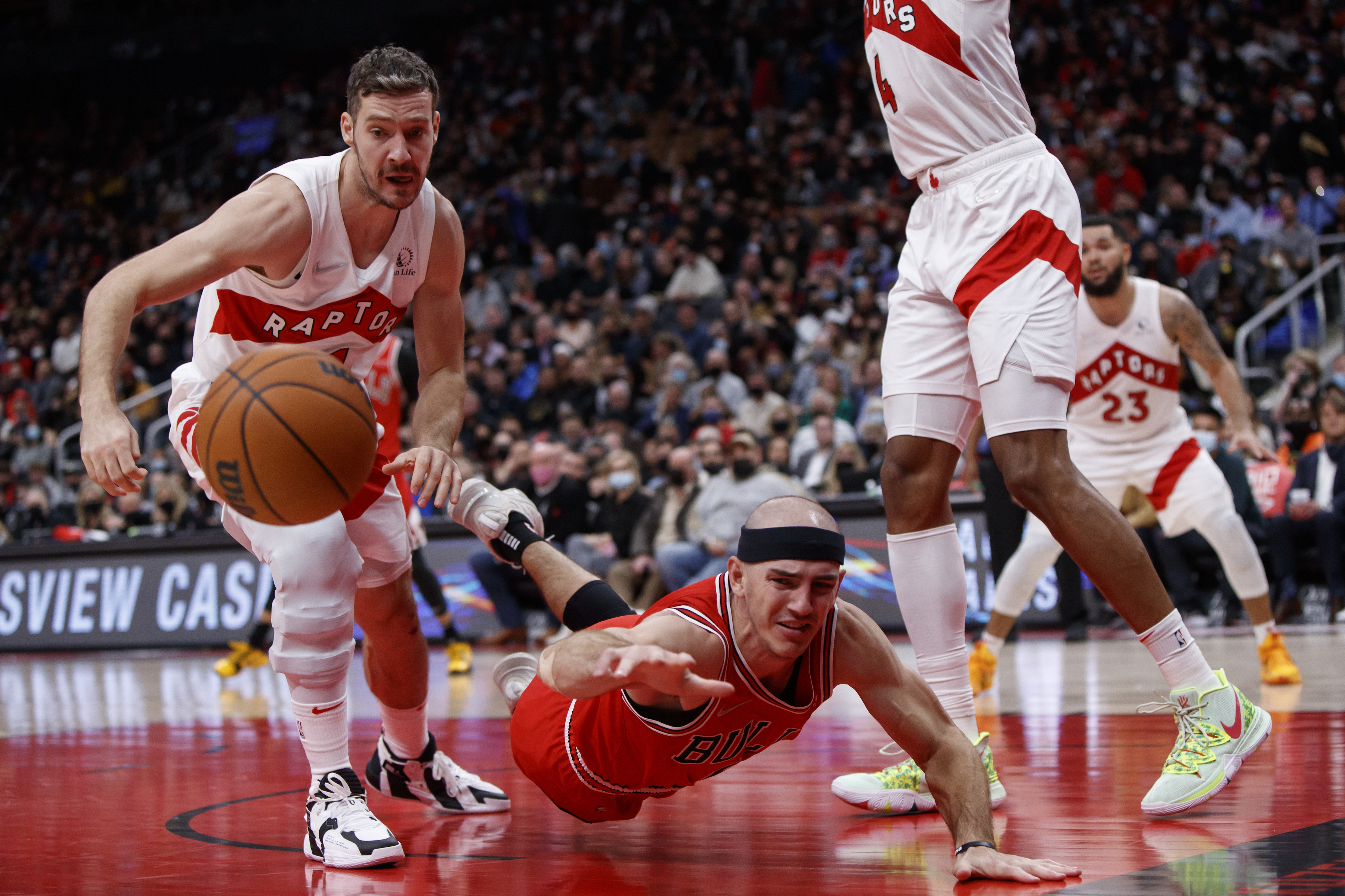Chicago Bulls guard Alex Caruso dives for a loose ball during a game against the Toronto Raptors
