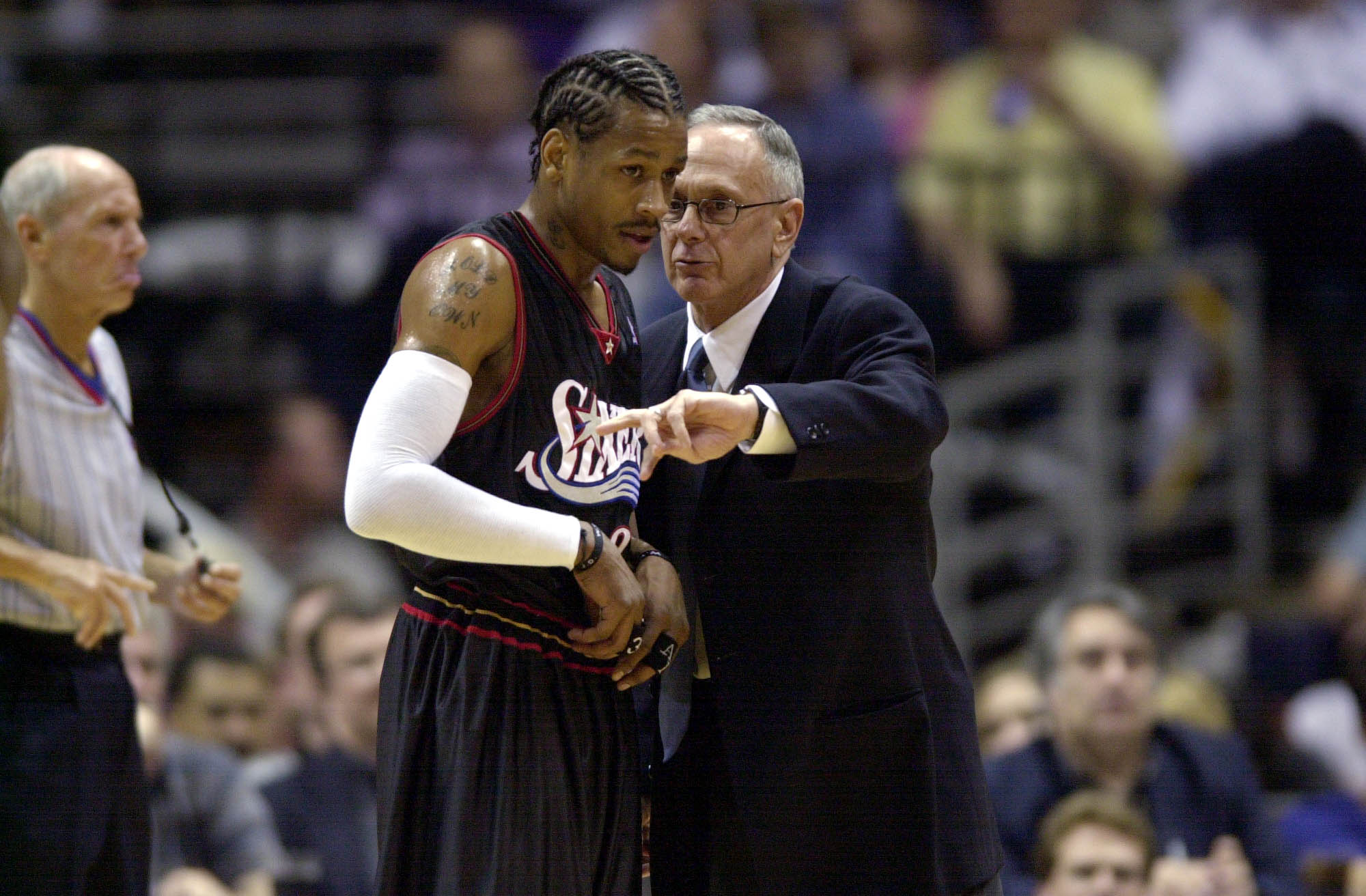 Allen Iverson talks with head coach Larry Brown.