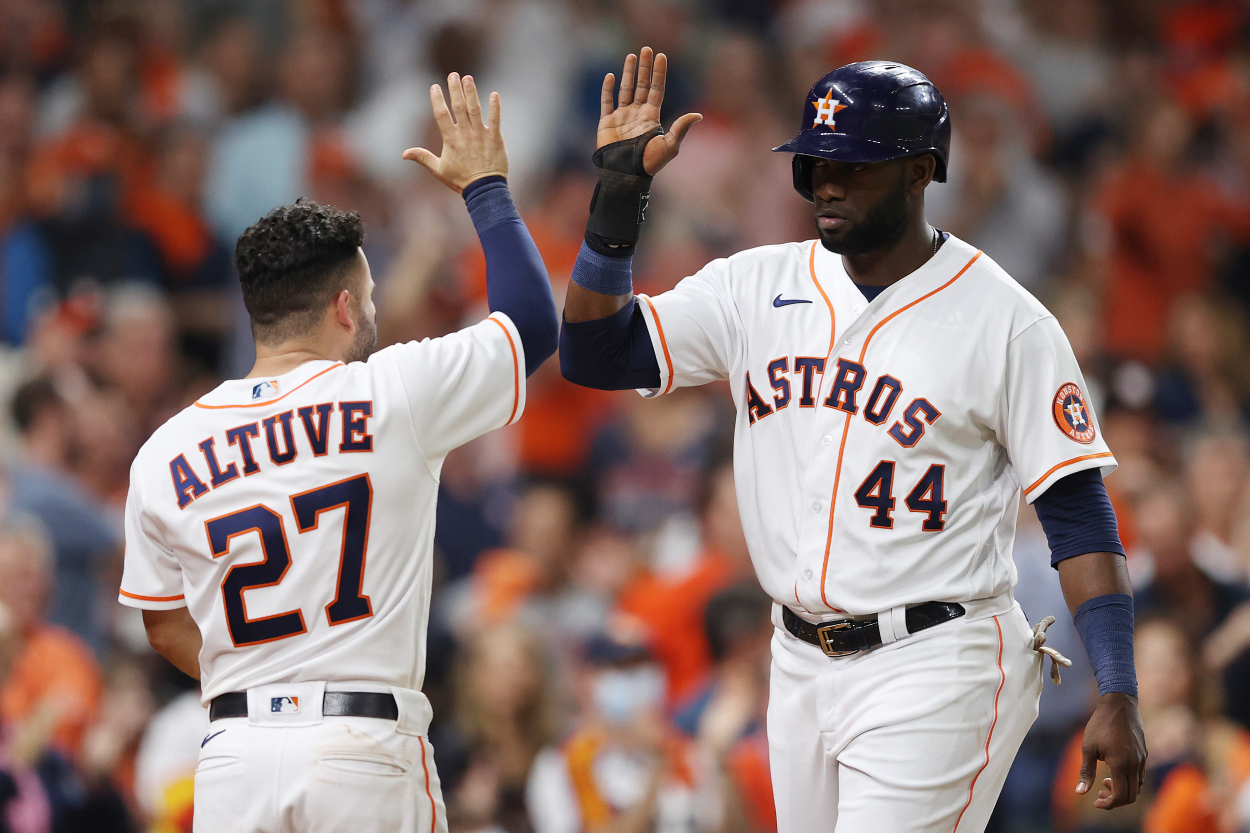 Yordan Alvarez #44 of the Houston Astros celebrates with Jose Altuve #27 after scoring on an unassisted double play.