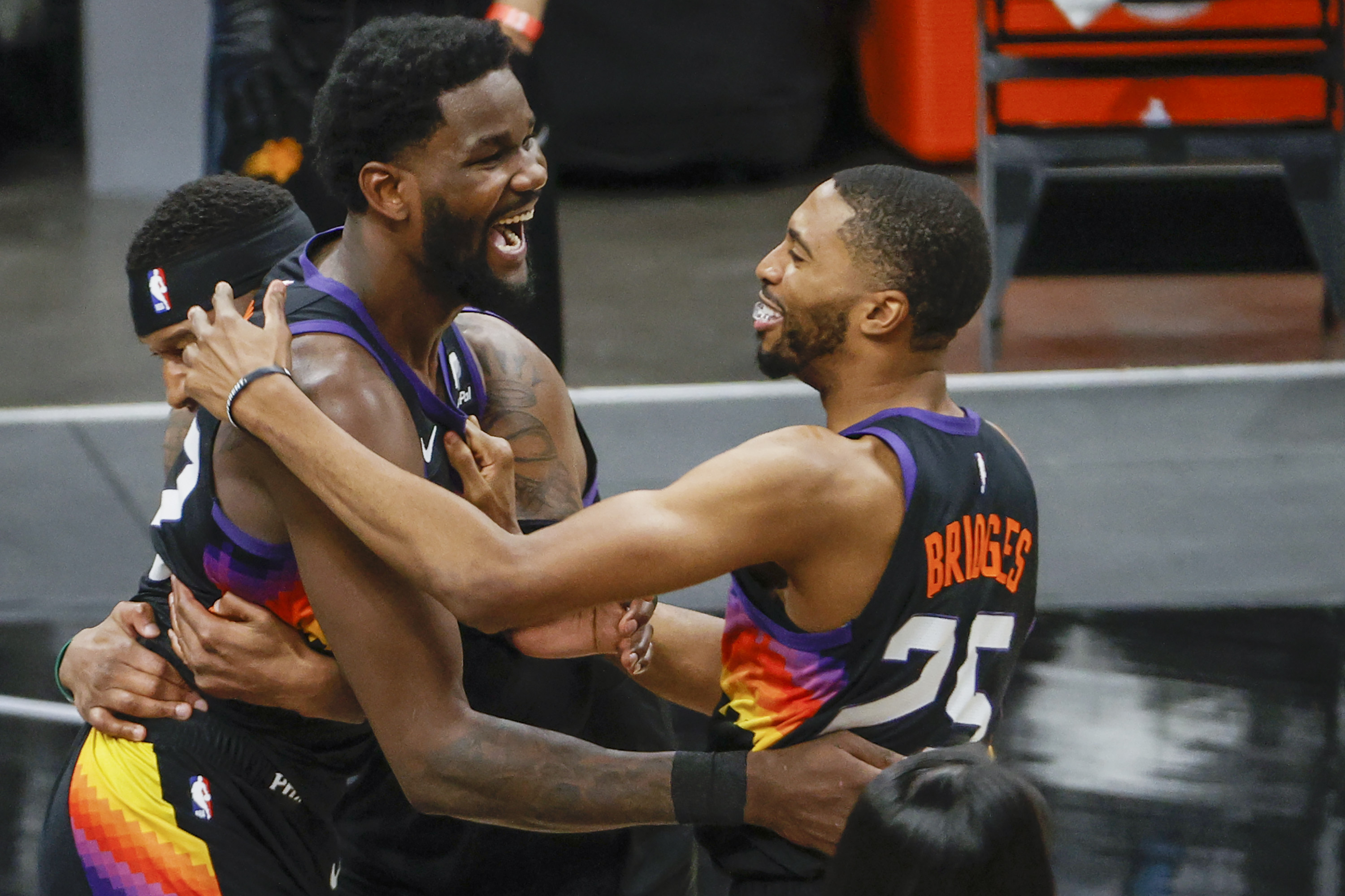 Suns teammates Deandre Ayton and Mikal Bridges celebrate after winning Game 2 of the Western Conference Finals