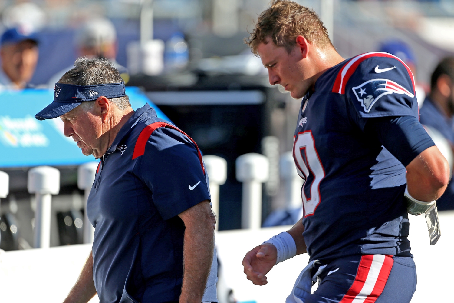 New England Patriots head coach Bill Belichick and quarterback Mac Jones exit the field after a loss to the New Orleans Saints.