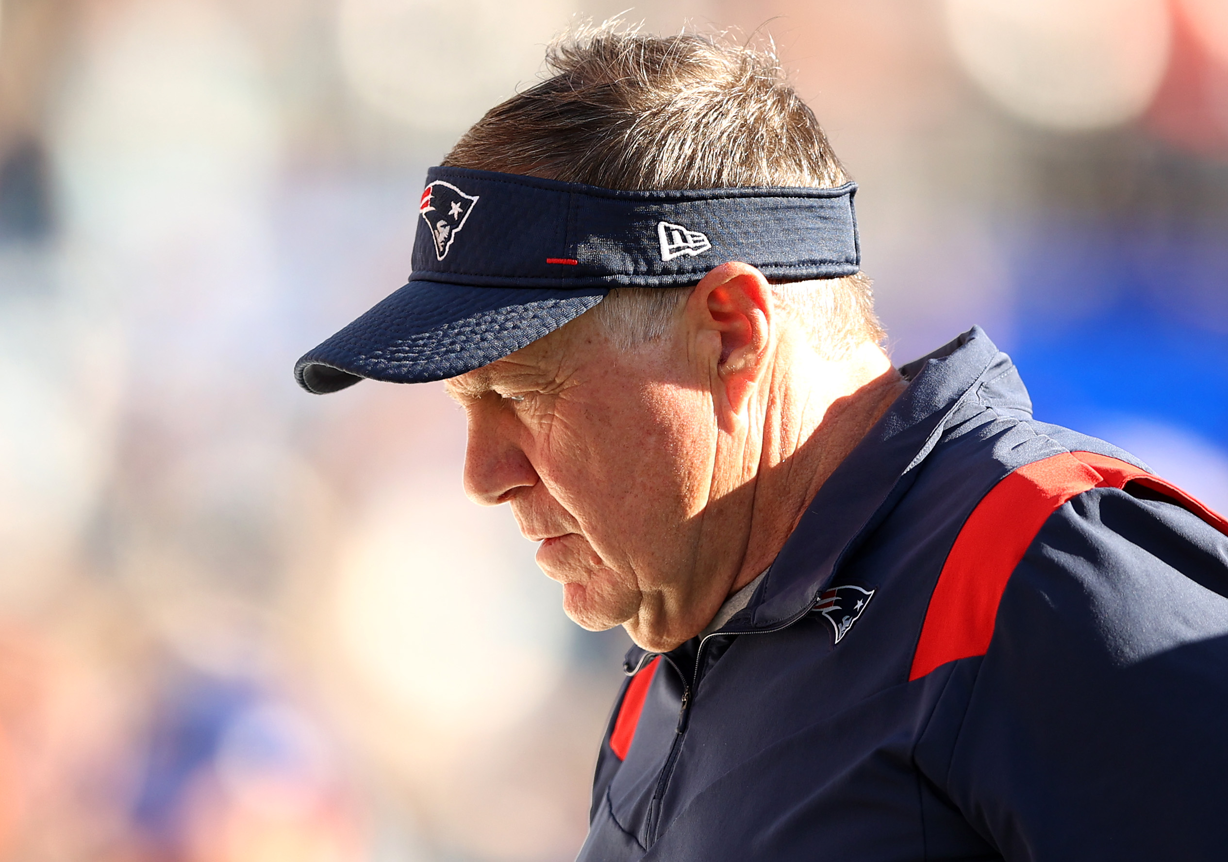 Head coach Bill Belichick of the New England Patriots walks off the field.