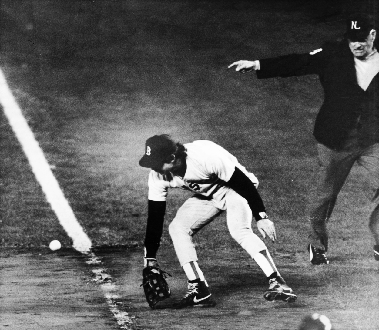 Bill Buckner of the Boston Red Sox makes an error at the bottom of the 10th inning in Game 6 of the 1986 World Series.