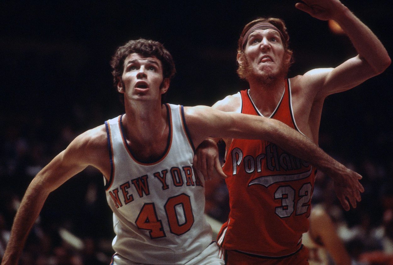 Former Portland Trail Blazers big man Bill Walton fights for a rebound