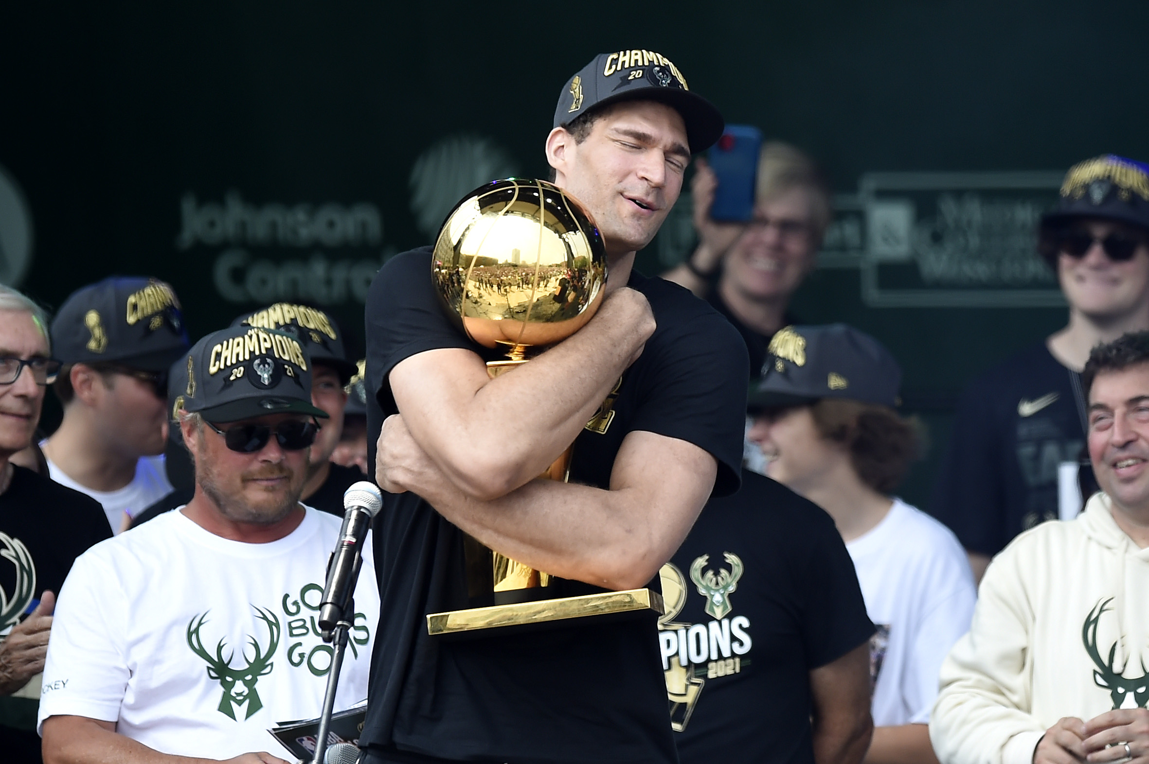 Brook Lopez celebrates with the Larry O'Brien trophy.