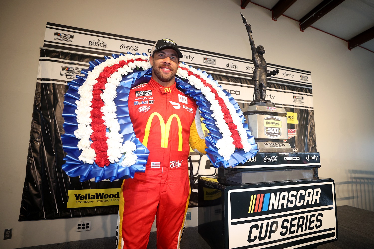 Bubba Wallace, driver of the No. 23 Toyota, celebrates in victory lane after winning the rain-shortened NASCAR Cup Series YellaWood 500 at Talladega Superspeedway on Oct. 4, 2021.