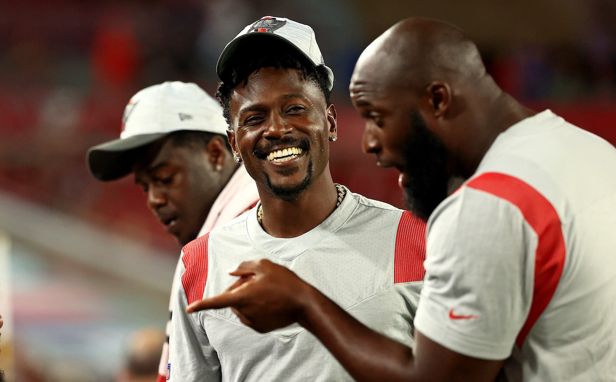Antonio Brown and Leonard Fournette laugh on the sideline