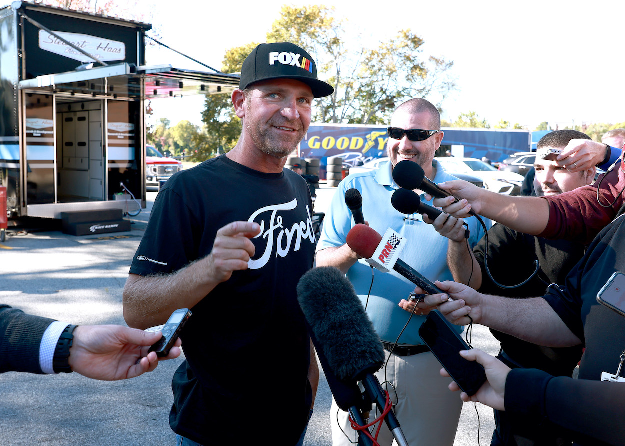 Clint Bowyer talks to reporters