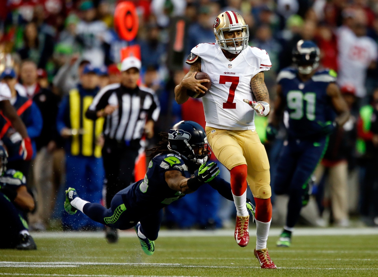 San Francisco 49ers quarterback Colin Kaepernick runs against the Seattle Seahawks in 2014.