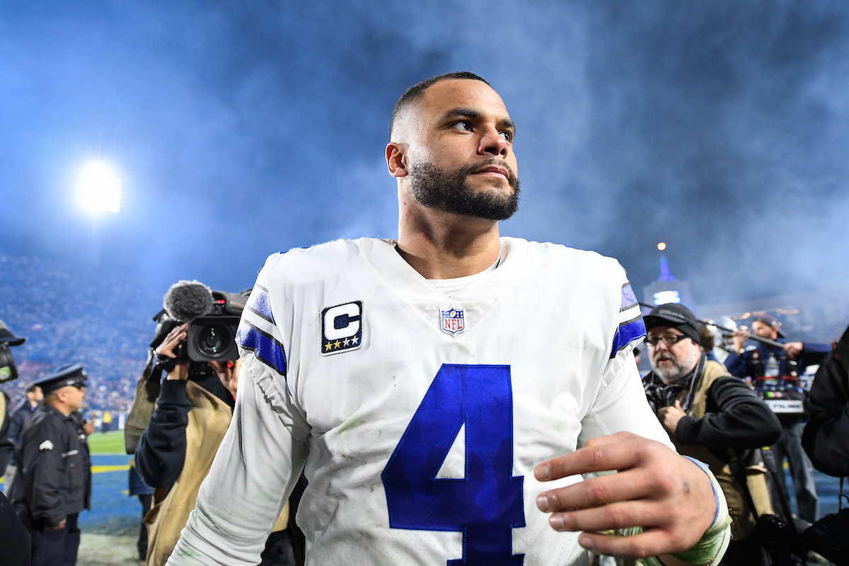 Quarterback Dak Prescott, #4 of the Dallas Cowboys, walks off the field after losing the NFC Divisional Round playoff game to the Los Angeles Rams at Los Angeles Memorial Coliseum on January 12, 2019, in Los Angeles, California