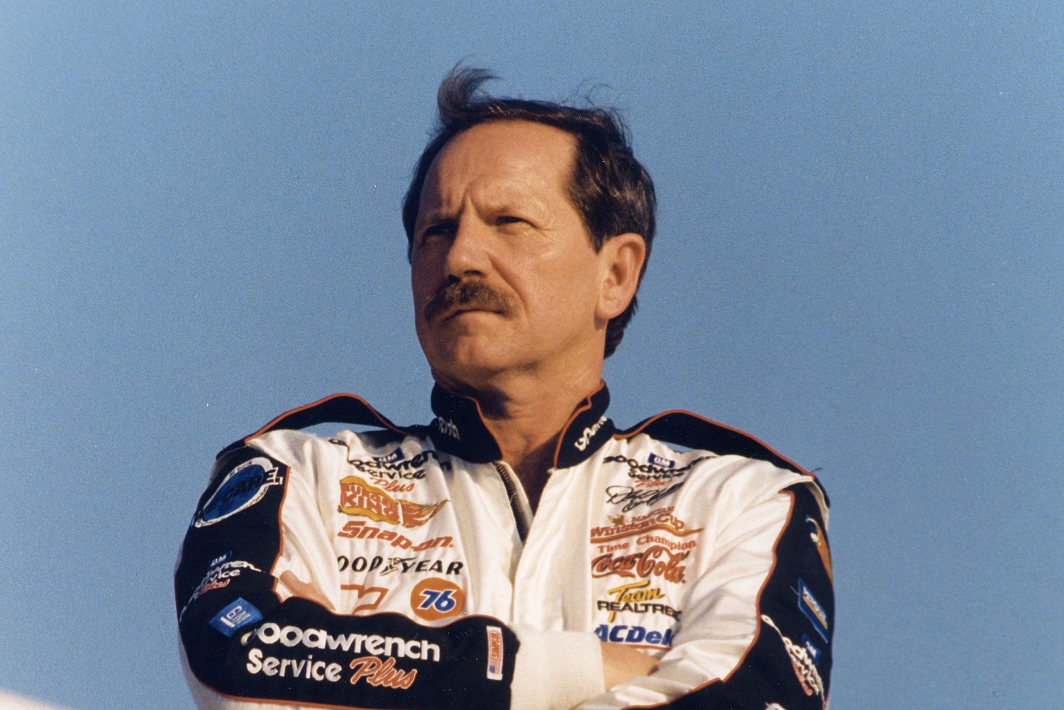 Dale Earnhardt, driver of the No. 3 Chevy, looks on before a race circa 1990.