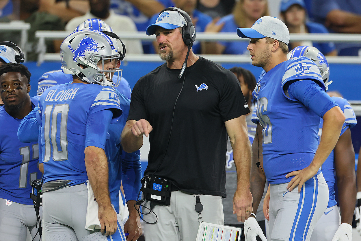 Detroit Lions head coach Dan Campbell talks to Detroit Lions quarterbacks David Blough (L) and Jared Goff on the sidelines after a play during the first half of an NFL preseason football game between the Detroit Lions and the Indianapolis Colts in Detroit, Michigan USA, on Friday, August 27, 2021.