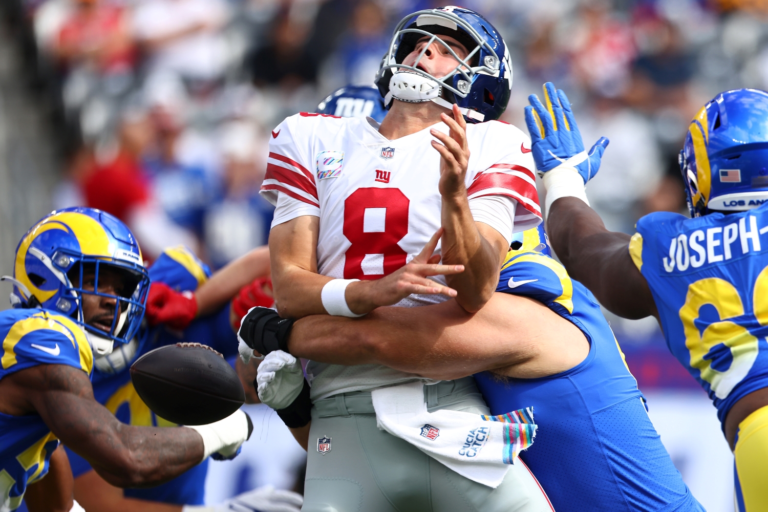 New York Giants QB Daniel Jones gets strip-sacked during a game against the Los Angeles Rams.