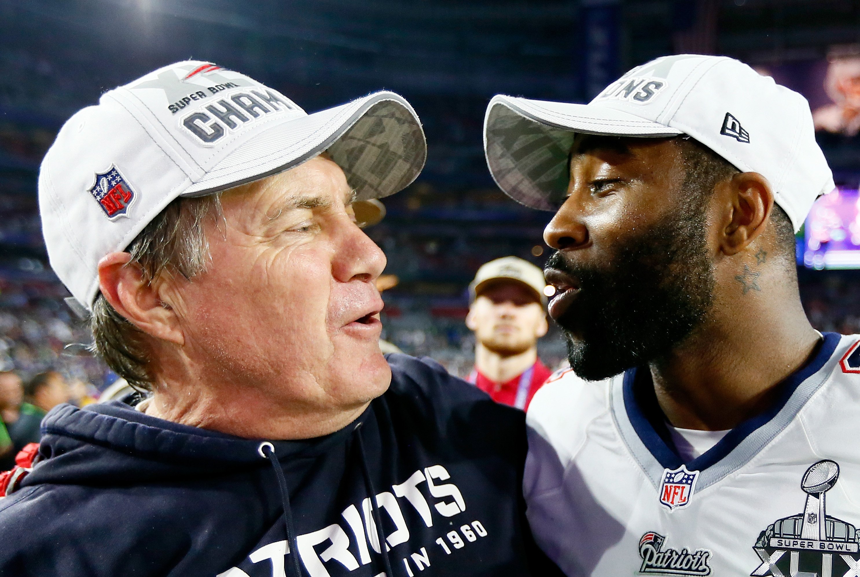 Patriots head coach Bill Belichick and Darrelle Revis talk after Super Bowl victory