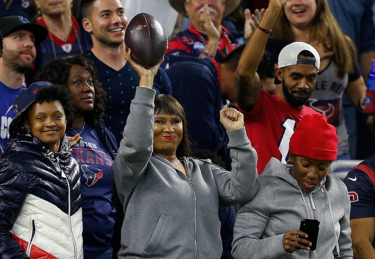 Sabrina Greenlee, the mother of wide receiver DeAndre Hopkins #10 of the Houston Texans celebrates with the game ball she received from her son after his touchdown