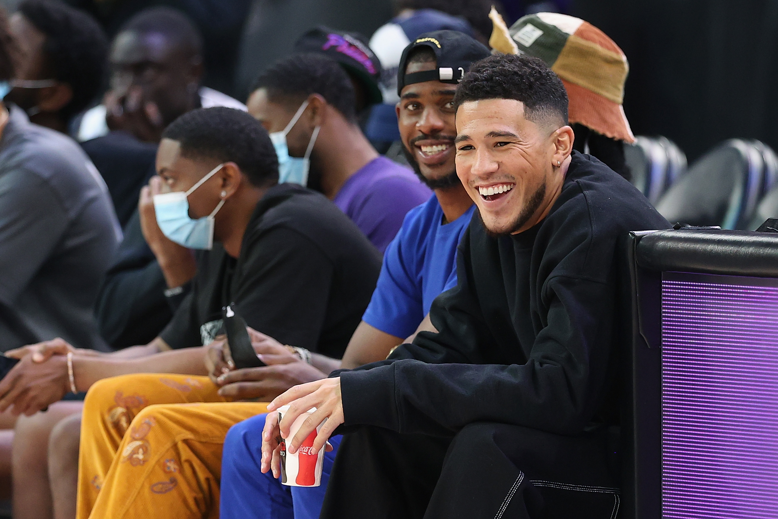 Phoenix Suns guard Devin Booker takes in a WNBA playoff game