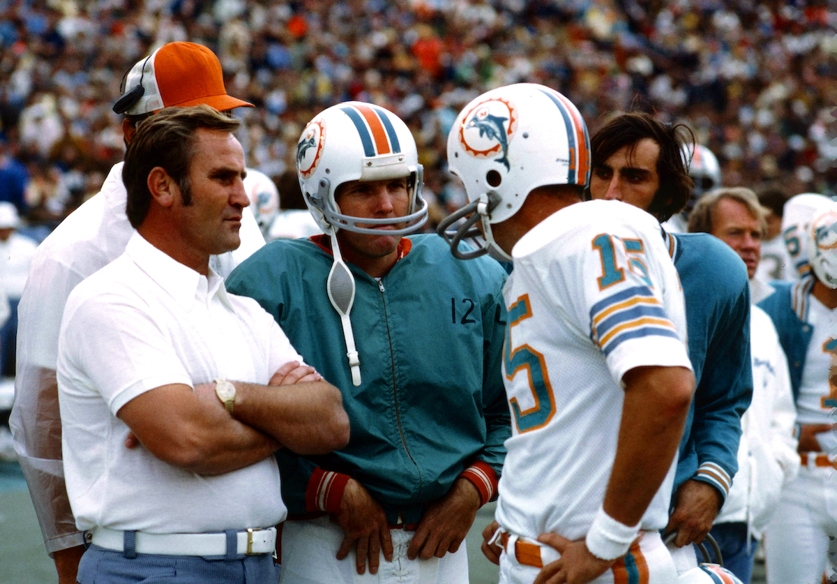 Don Shula, coach of the Miami Dolphins, speaks with quarterbacks Bob Griese and Earl Morrall during a 1972 game