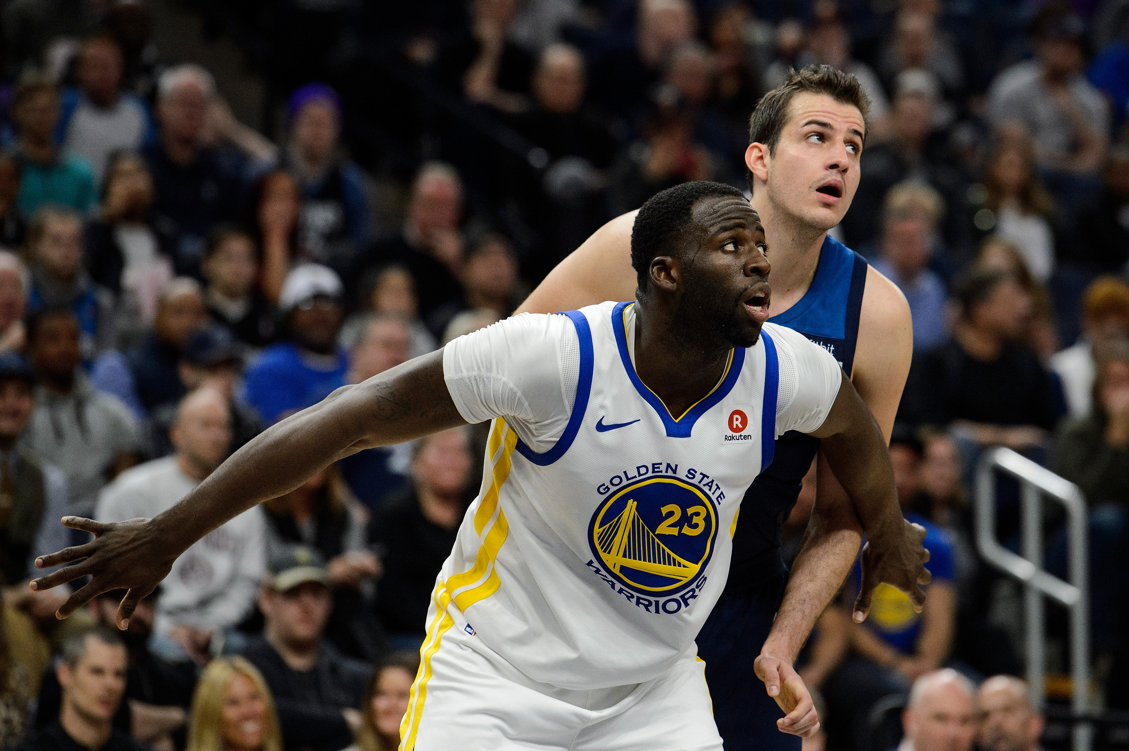 Warriors forward Draymond Green boxes out Nemanja Bjelica during a game in 2018