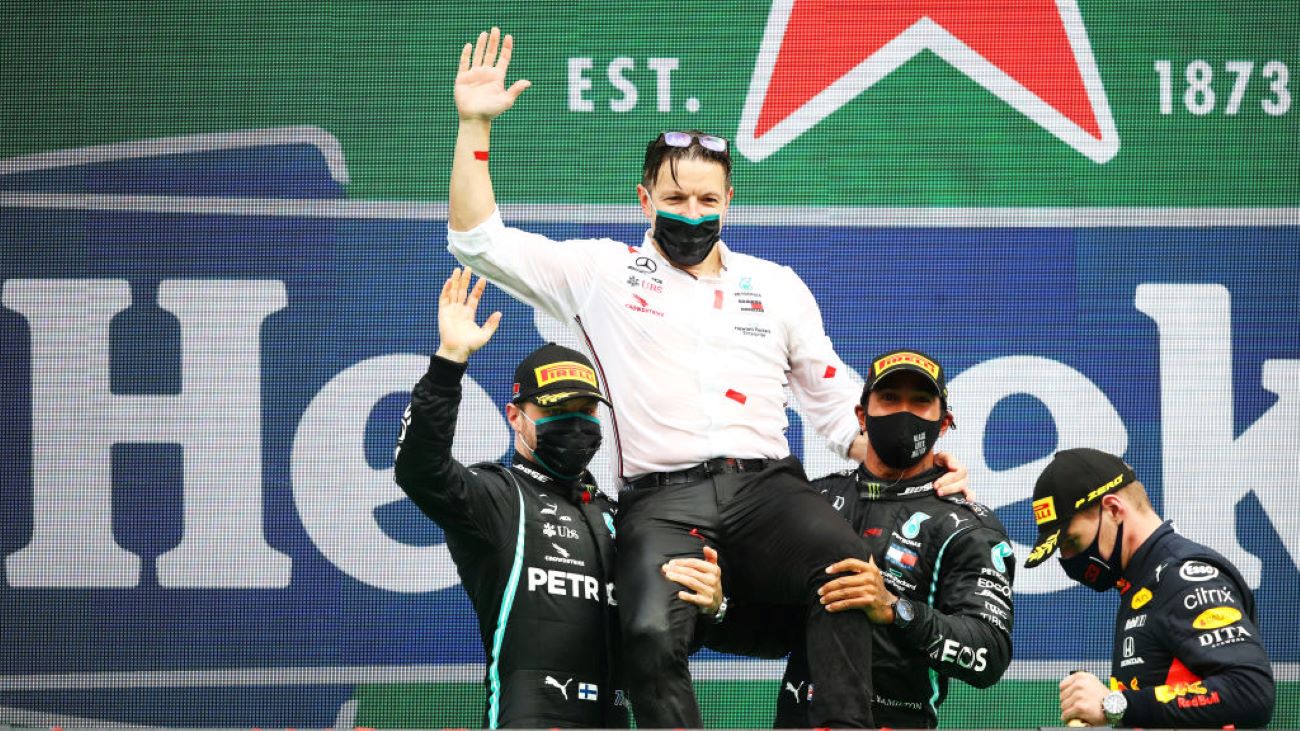 Formula 1 drivers Lewis Hamilton and Valtteri Bottas hold up race engineer Peter Bonnington on the podium following the Grand Prix of Portugal on Oct. 25, 2020. It was Hamilton and Bonnington’s record-breaking 92nd win as teammates.