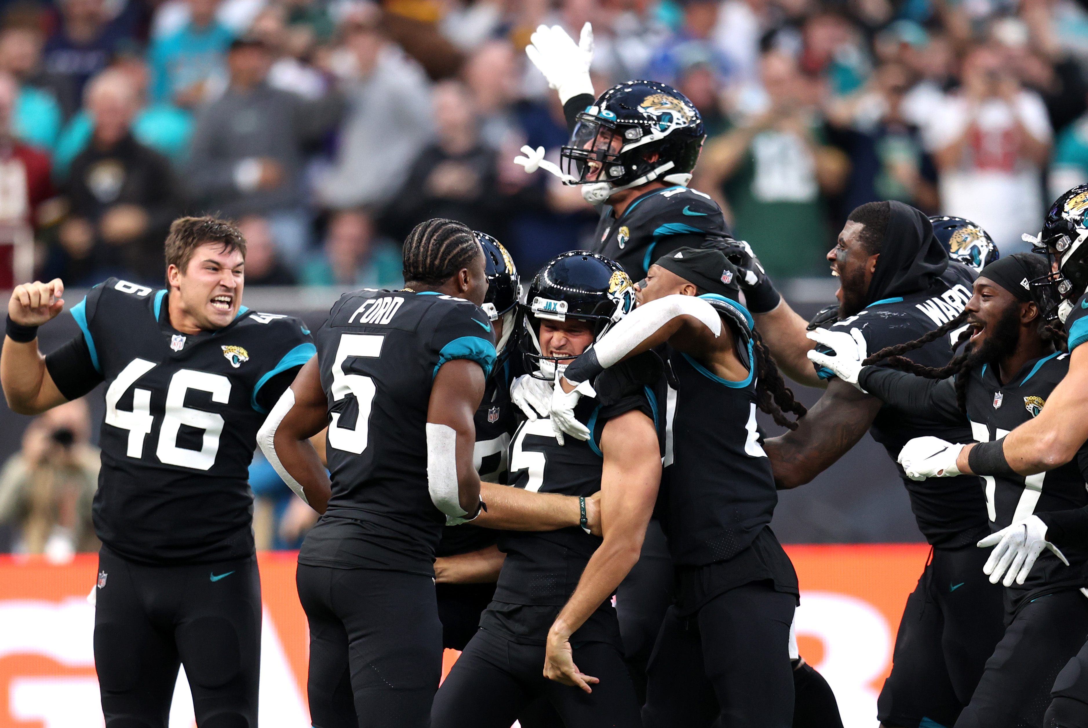 The Jaguars beat the Dolphins in London as Urban Meyer got his first victory.