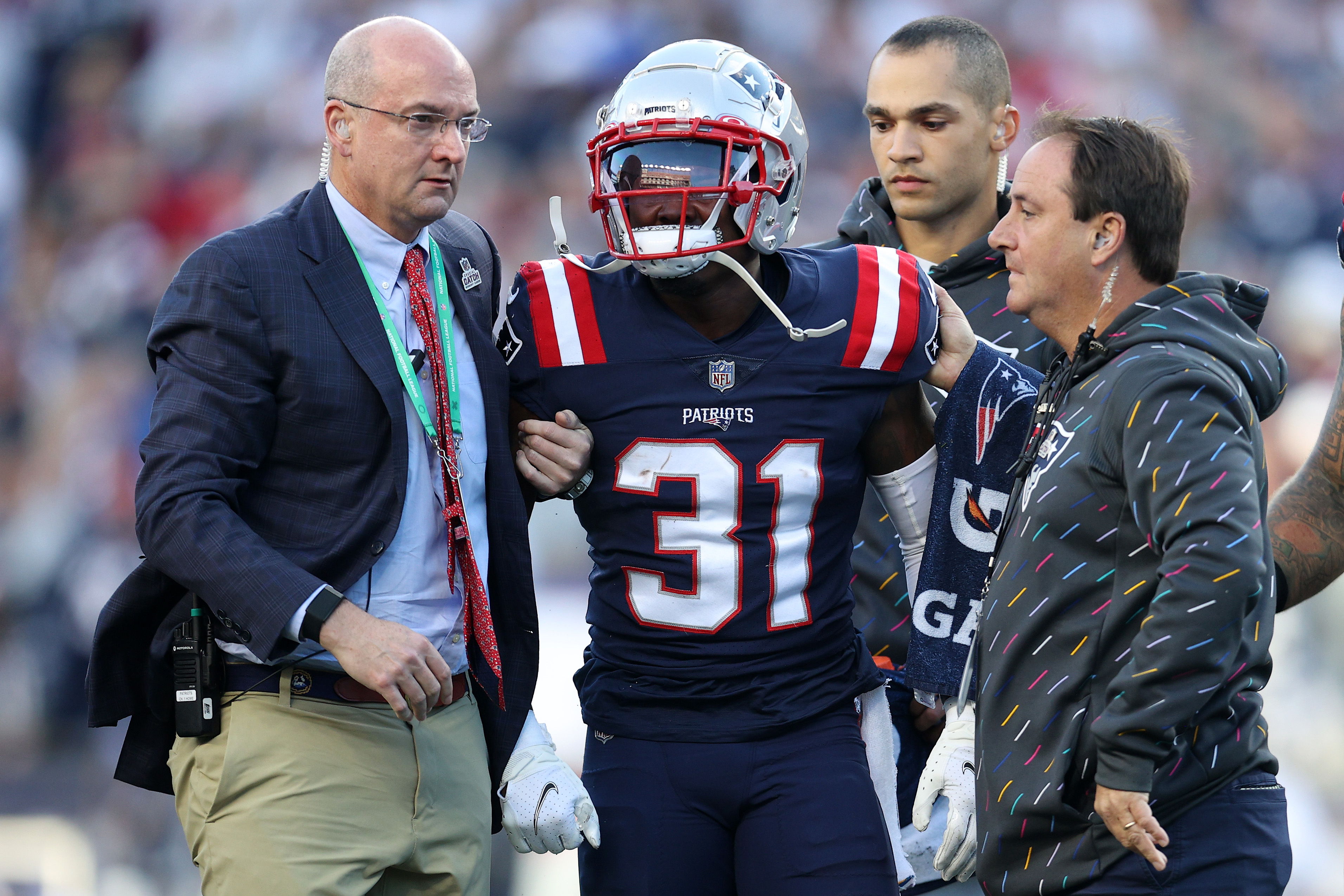 Jonathan Jones #31 of the New England Patriots is helped off the field after being injured in the first quarter against the Dallas Cowboys.
