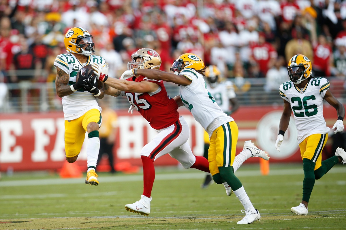 Green Bay Packers cornerback Jaire Alexander intercepts the football against the San Francisco 49ers