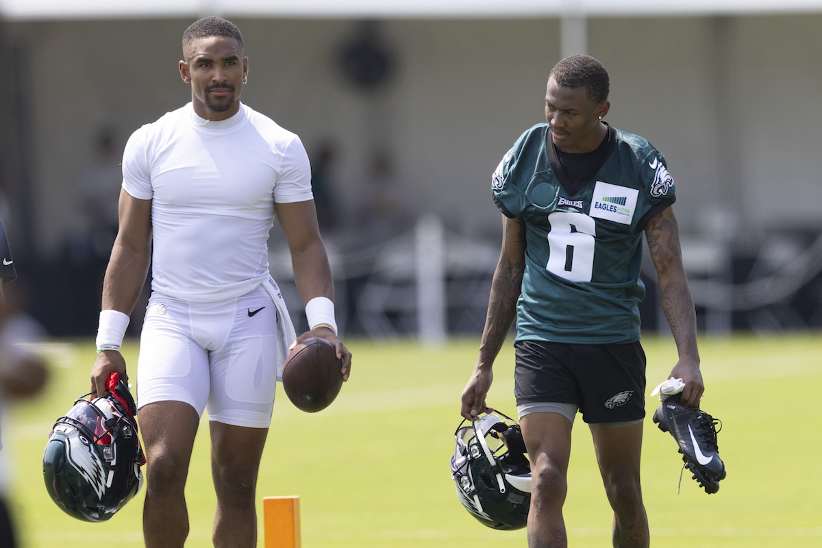 Jalen Hurts and DeVonta Smith of the Philadelphia Eagles walk off the field during training camp