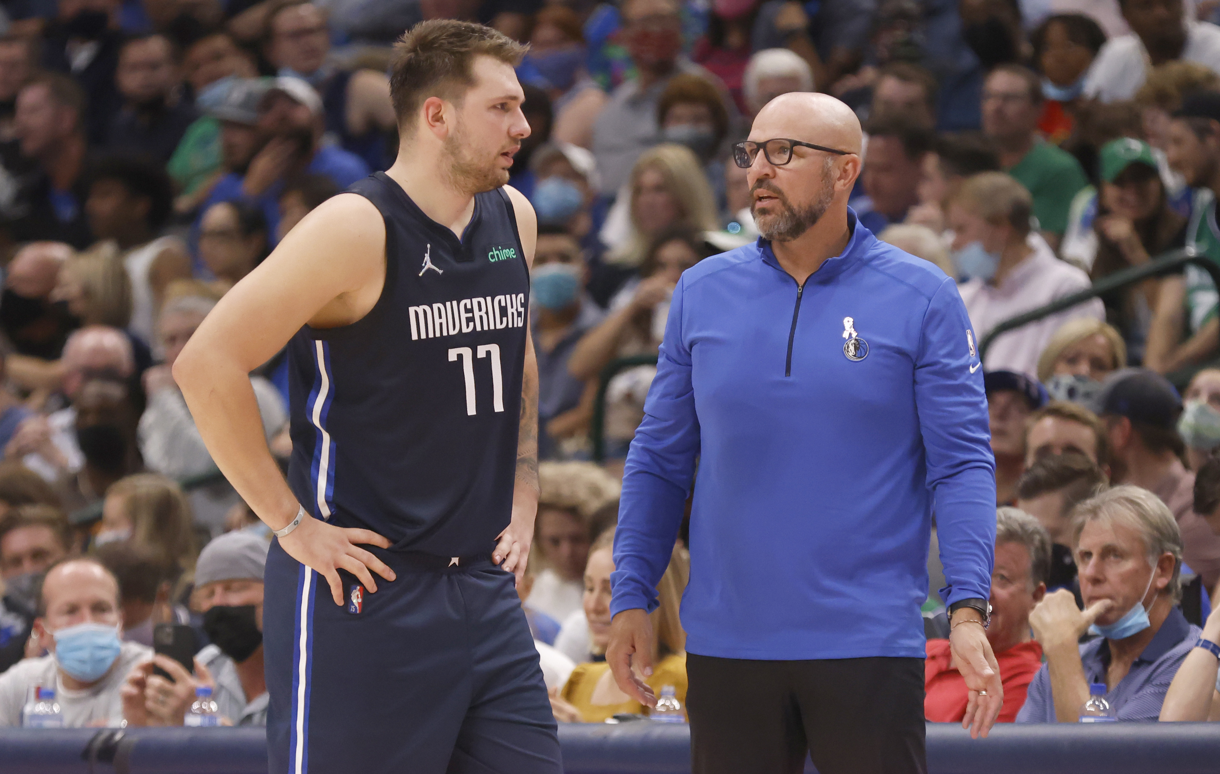 Dallas Mavericks star Luka Doncic speaks with head coach Jason Kidd during a game against the Houston Rockets