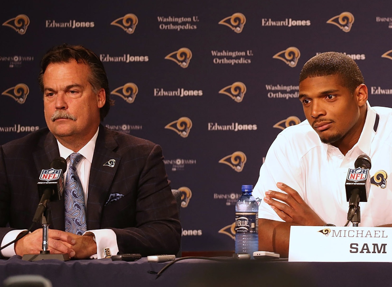 St. Louis Rams head coach Jeff Fisher (L) and pass-rusher Michael Sam in 2014. Former Las Vegas Raiders head coach Jon Gruden accused the Rams of being pressured to draft Sam, who is gay.