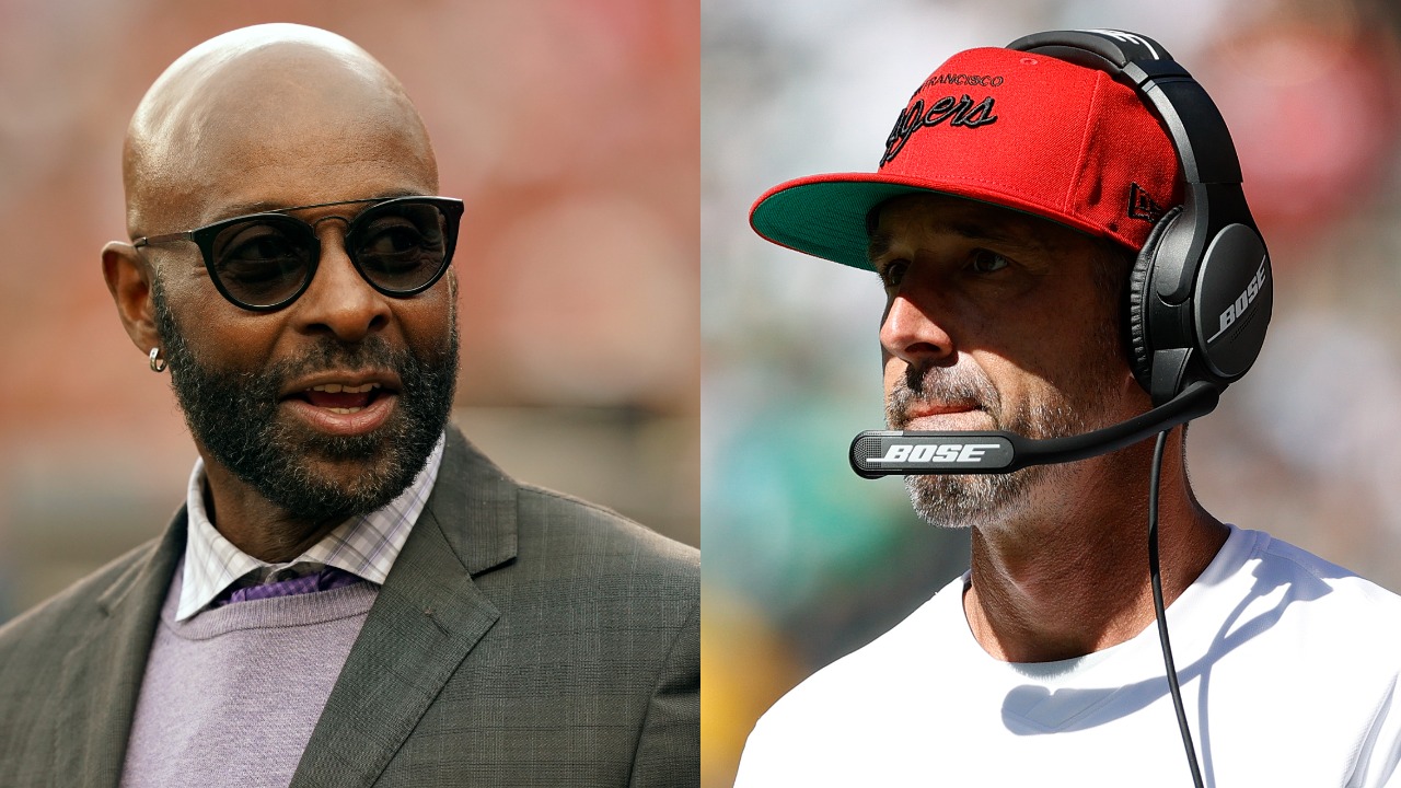 Hall of Fame wide receiver Jerry Rice attends an NFL game; 49ers head coach Kyle Shanahan looks on from the sideline