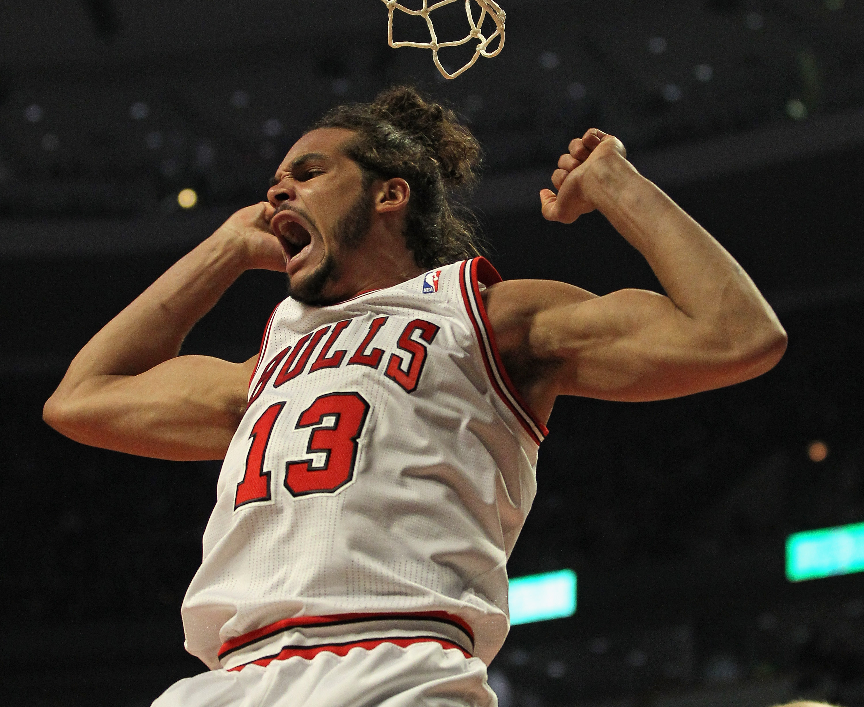 Former Chicago Bulls center Joakim Noah dunks a ball during a game in 2012