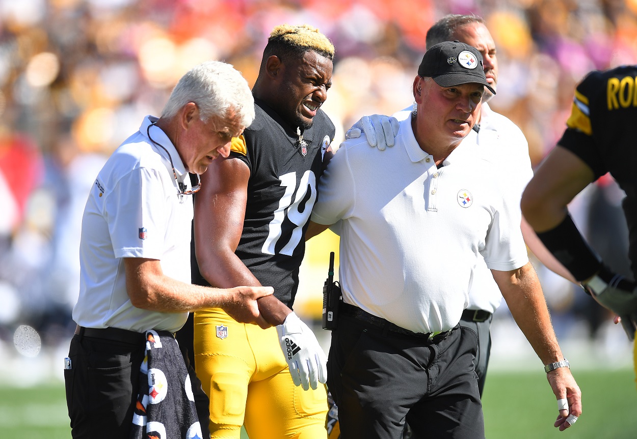 Juju Smith-Schuster of the Pittsburgh Steelers walks off the field due to injury against the Denver Broncos