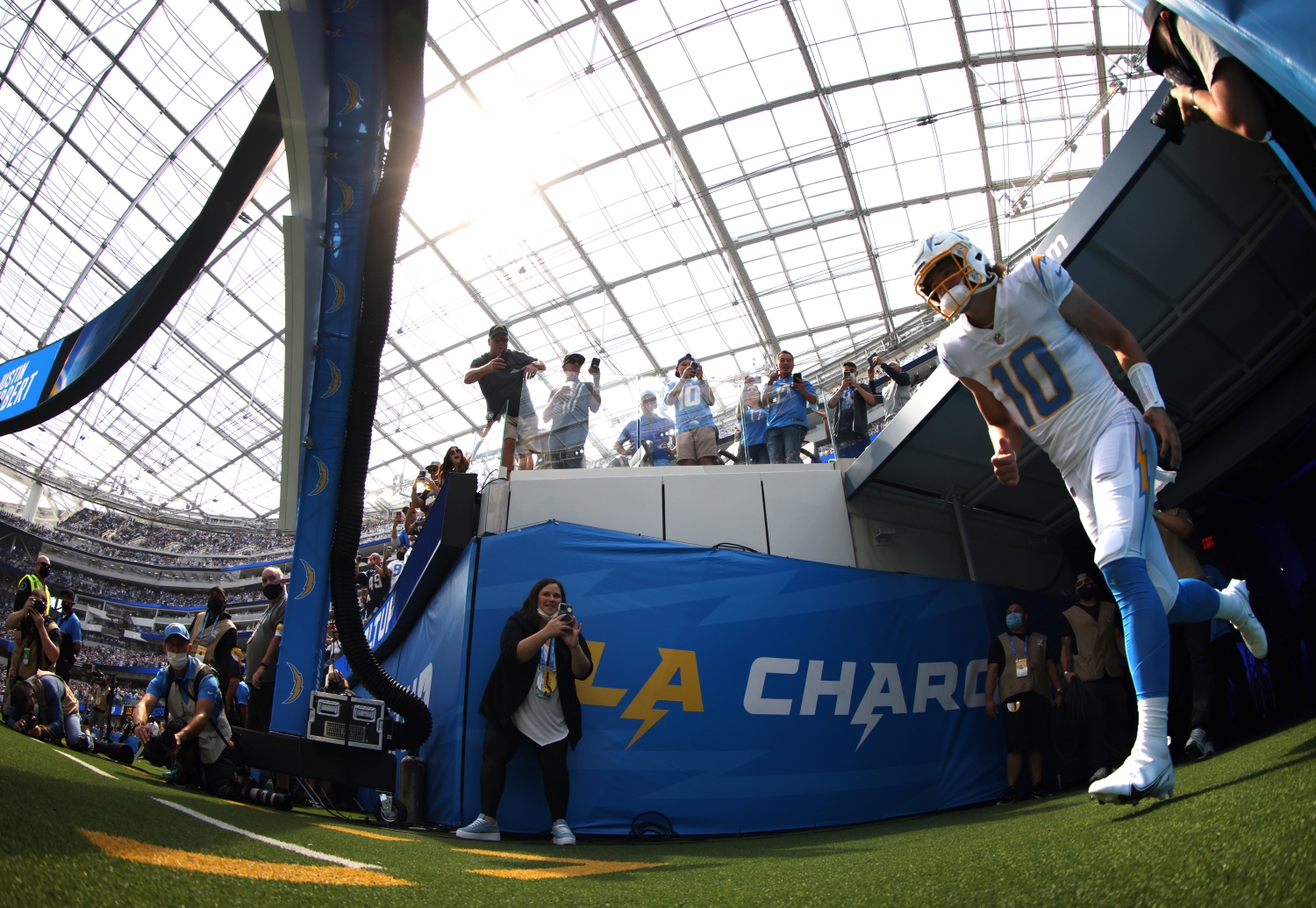 Los Angeles Chargers quarterback Justin Herbert jogs out of the tunnel.