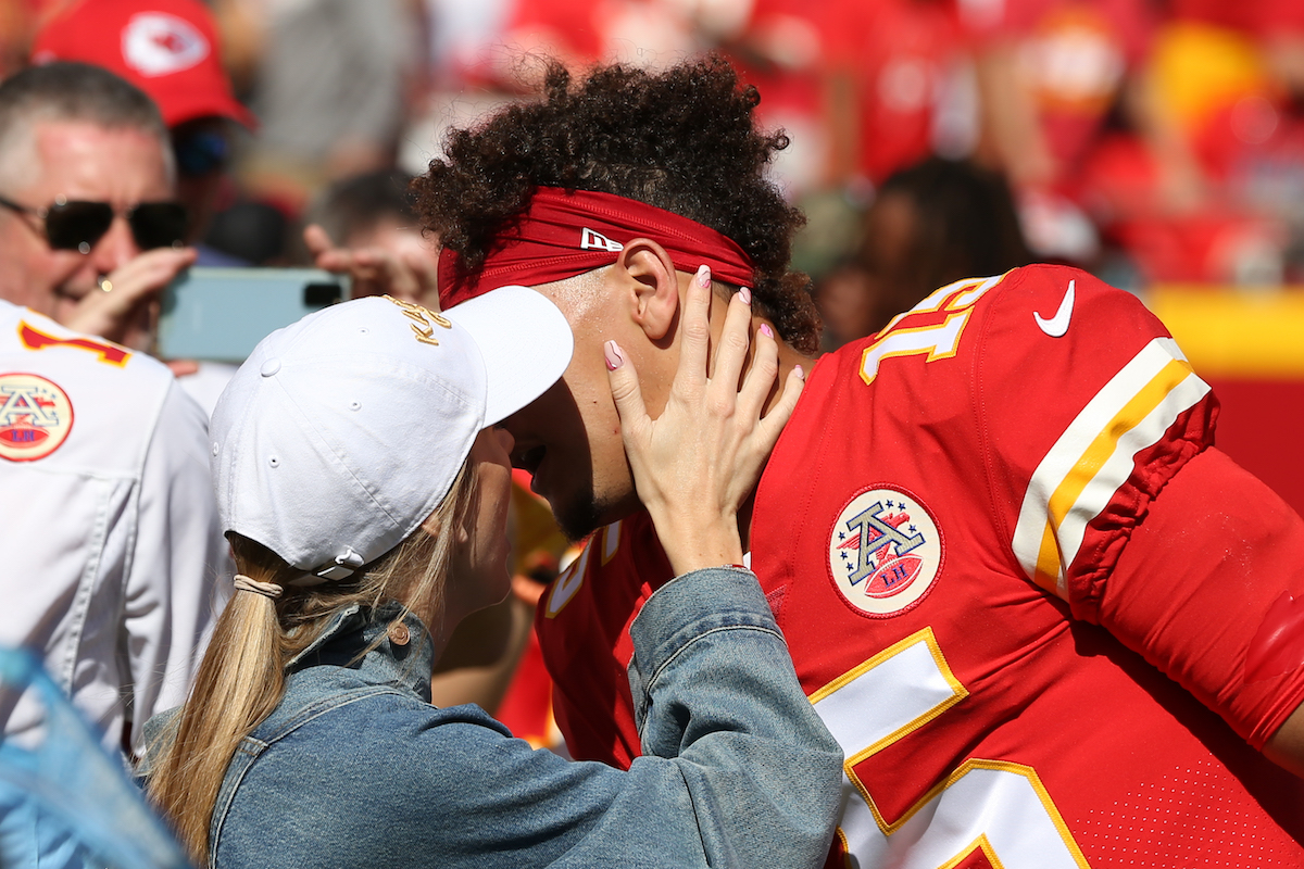 Kansas City Chiefs quarterback Patrick Mahomes gets a kiss from his fiancé Brittany Matthews