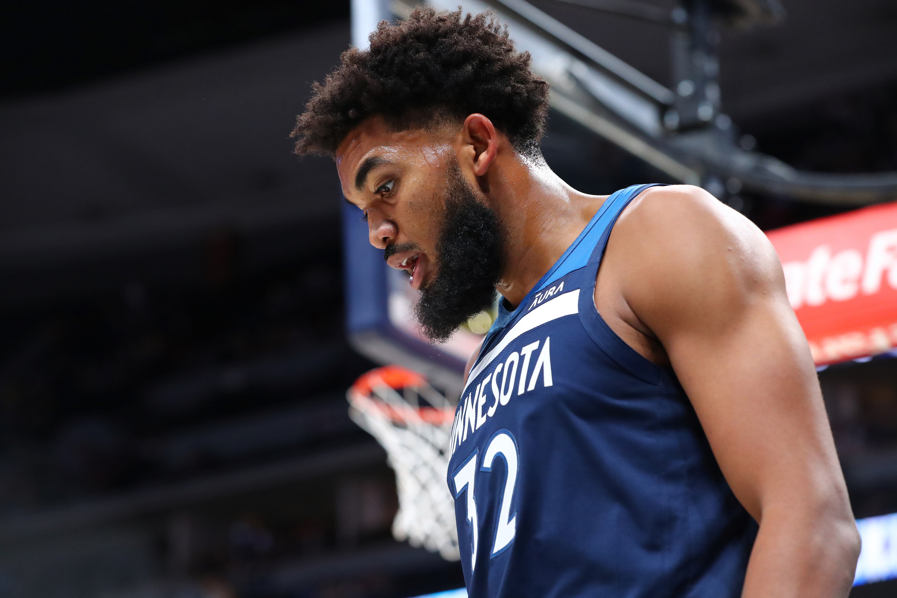Timberwolves star Karl-Anthony Towns looks on during a preseason game