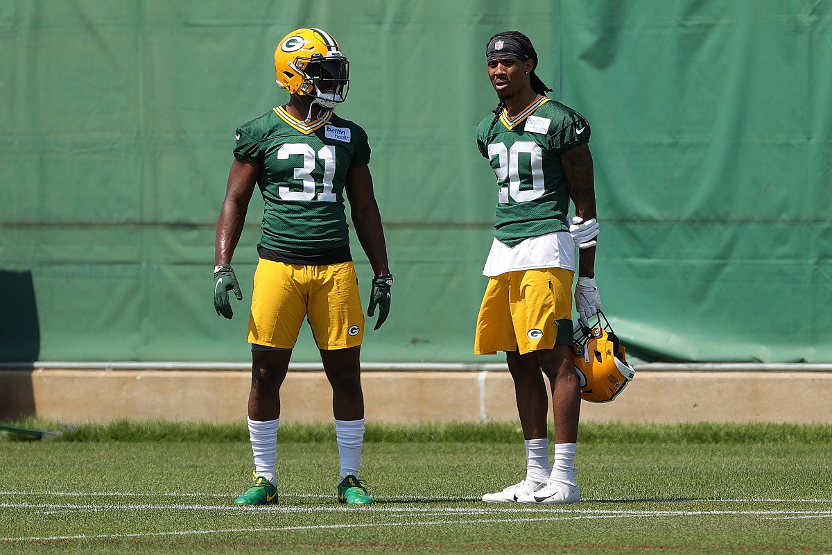 Kevin King and Adrian Amos of the Green Bay Packers talk at a practice in October of 2021