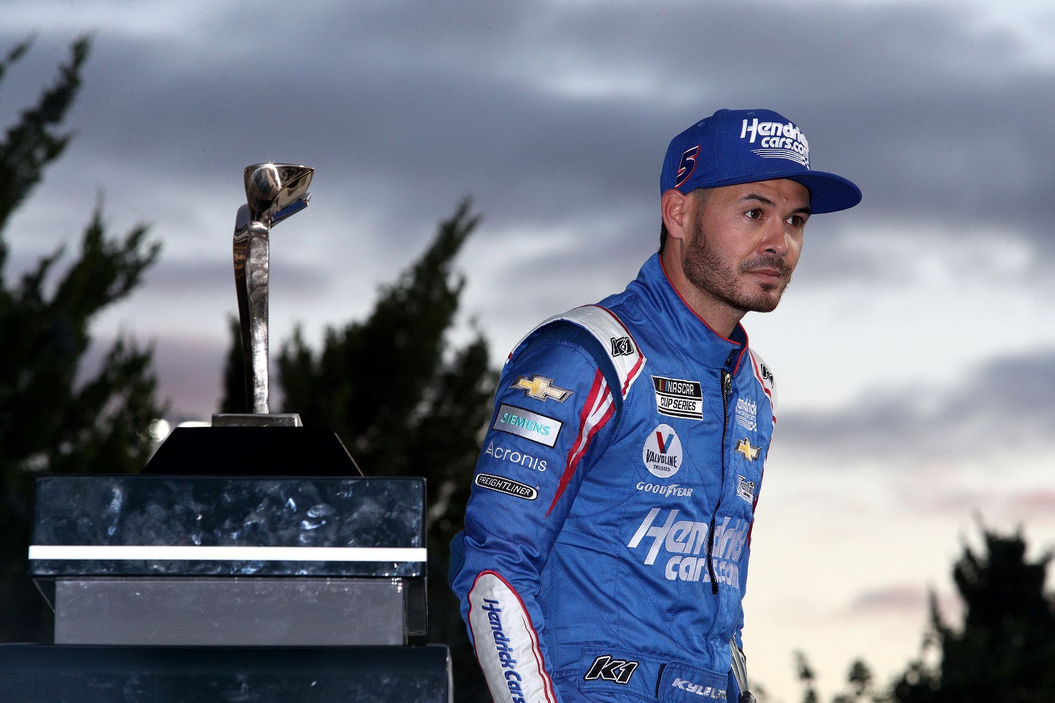 Kyle Larson, driver of the No. 5 Chevy, looks on from victory lane after winning the NASCAR Cup Series Hollywood Casino 400 at Kansas Speedway on Oct. 24, 2021.