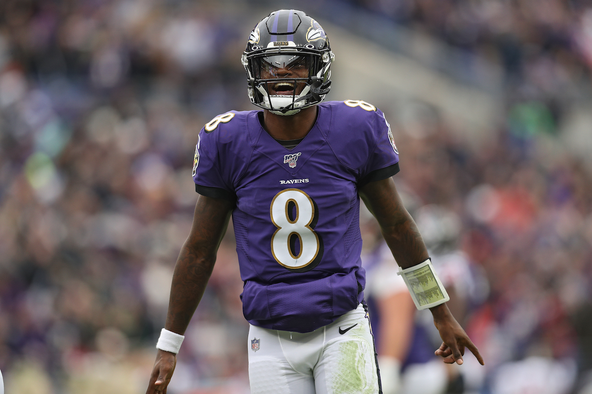 Quarterback Lamar Jackson, #8 of the Baltimore Ravens, reacts after throwing a touchdown pass to tight end Mark Andrews, #89 of the Baltimore Ravens, against the Houston Texans during the second quarter at M&T Bank Stadium on November 17, 2019, in Baltimore, Maryland