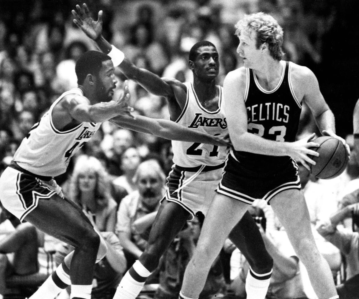 Larry Bird (R) handles the ball during the 1984 NBA Finals.