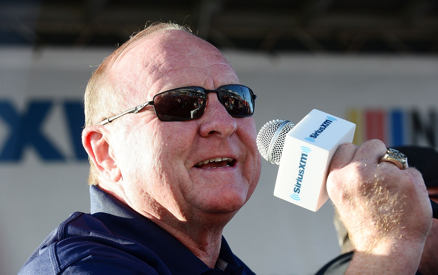 Larry McReynolds on stage at the SiriusXM NASCAR Radio at the Daytona 500 on Feb. 15, 2018, in Daytona Beach, Florida. | Gerardo Mora/Getty Images for SiriusXM