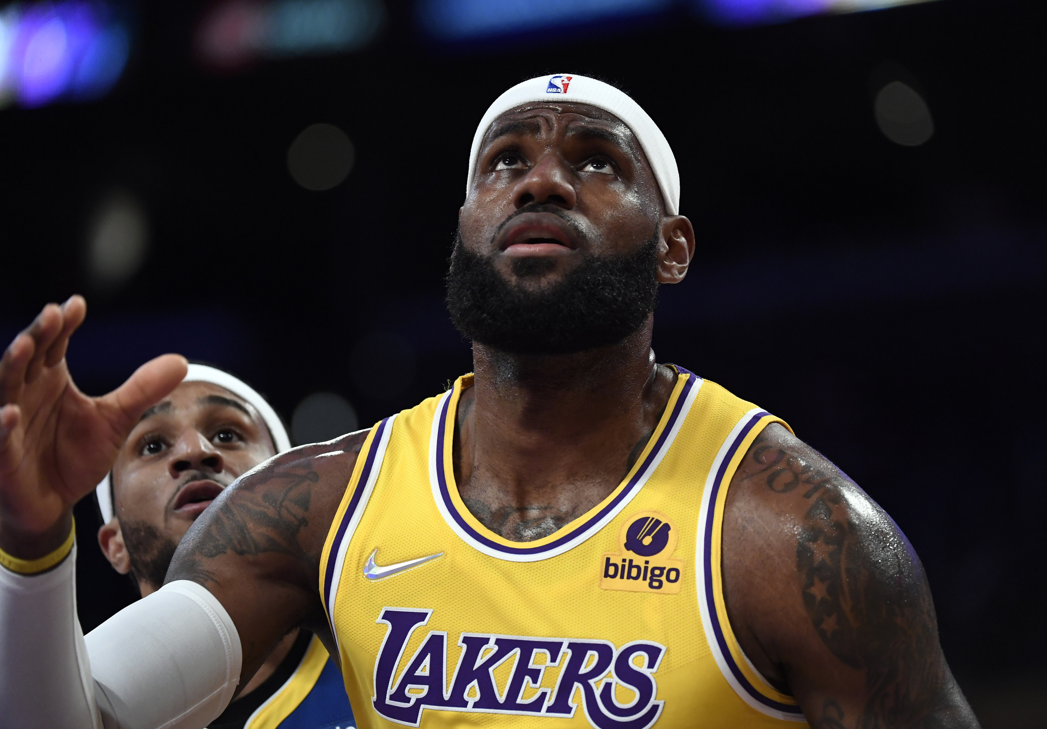 Los Angeles Lakers star LeBron James awaits a rebound during a preseason game