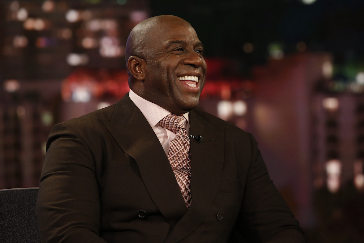 Magic Johnson laughs as he's interviewed by Jimmy Kimmel