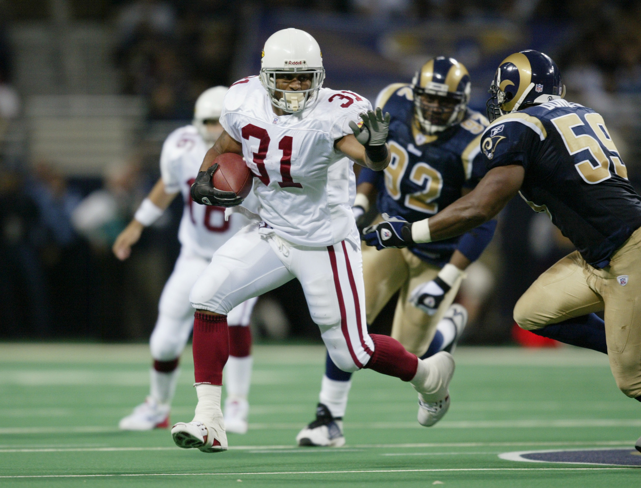 The Arizona Cardinals and St. Louis Rams face off in 2002.