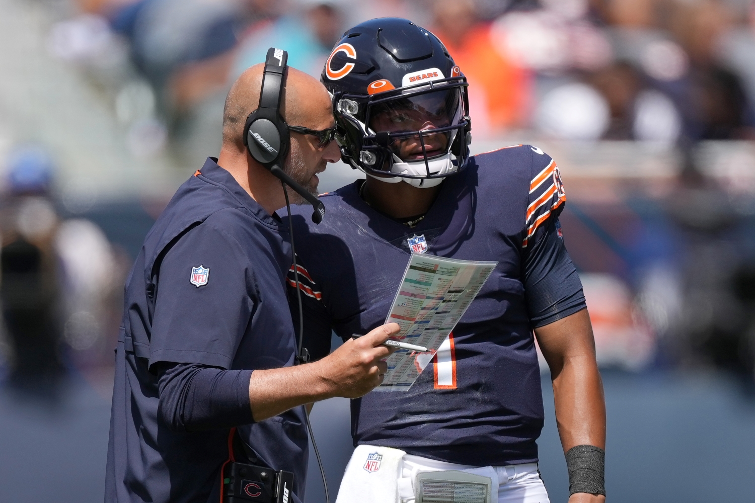 Chicago Bears head coach Matt Nagy speaks to rookie quarterback Justin Fields before a play.